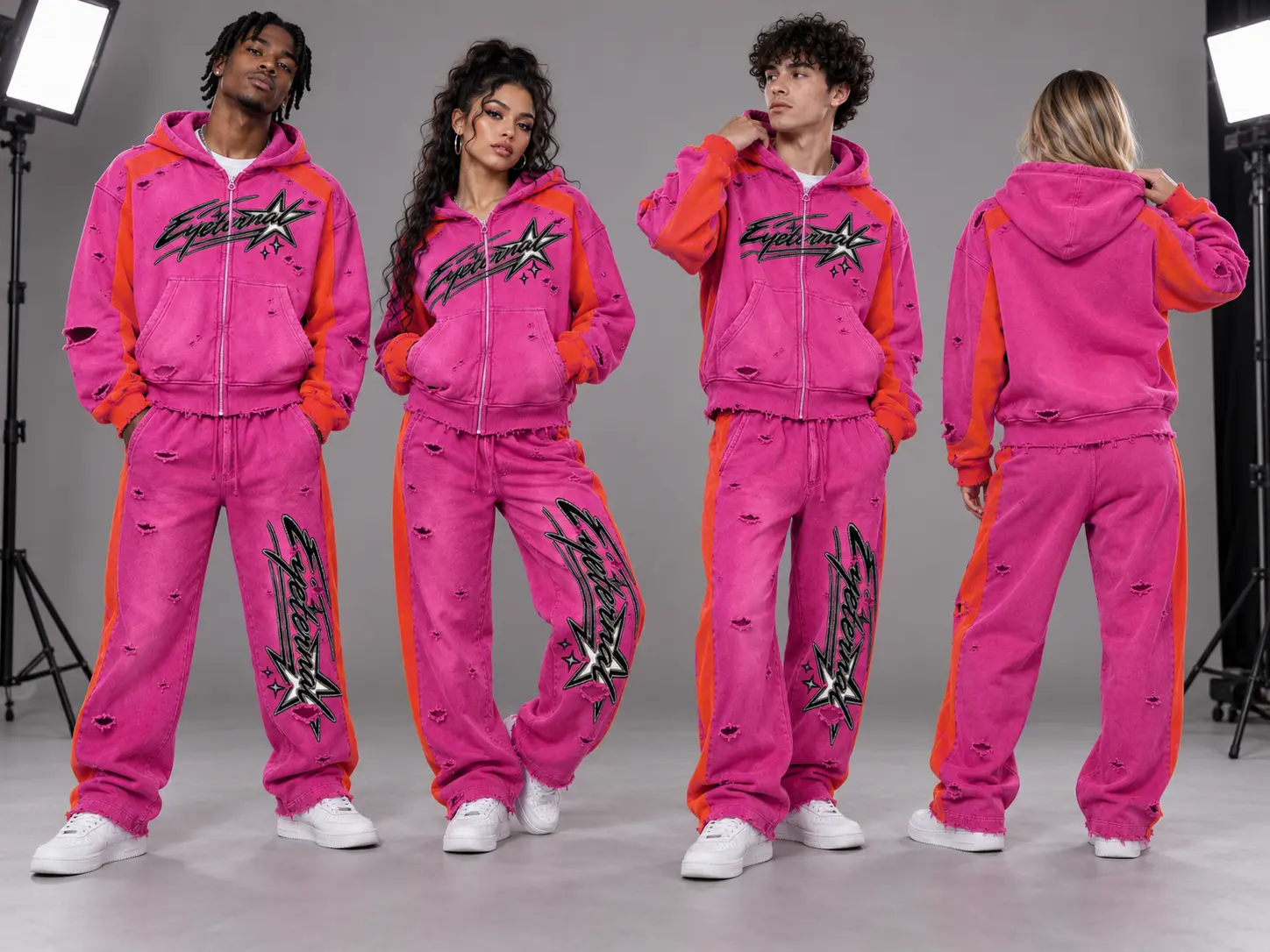 Four models in the magenta and orange Eyeternal star burst zip tracksuit